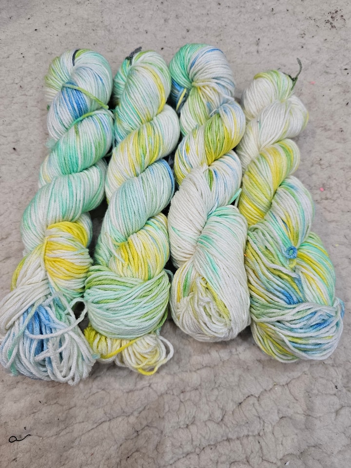 white with sections of yellow, blue and green